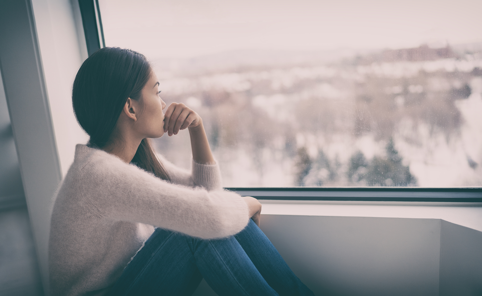 Depressed woman staring outside